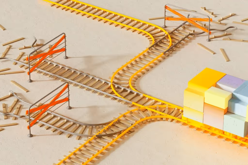 Yellow and silver train tracks intersecting with barriers, representing complex pathways.