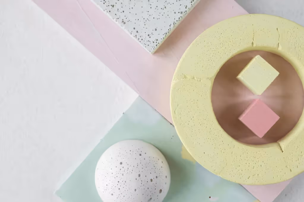 Modern minimalist composition of textured shapes in soft pastel colors.