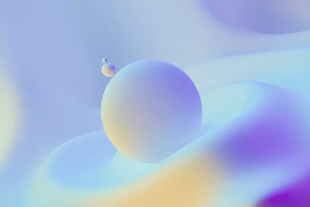 Soft pastel 3D-rendered abstract spheres floating in a dreamy gradient landscape.