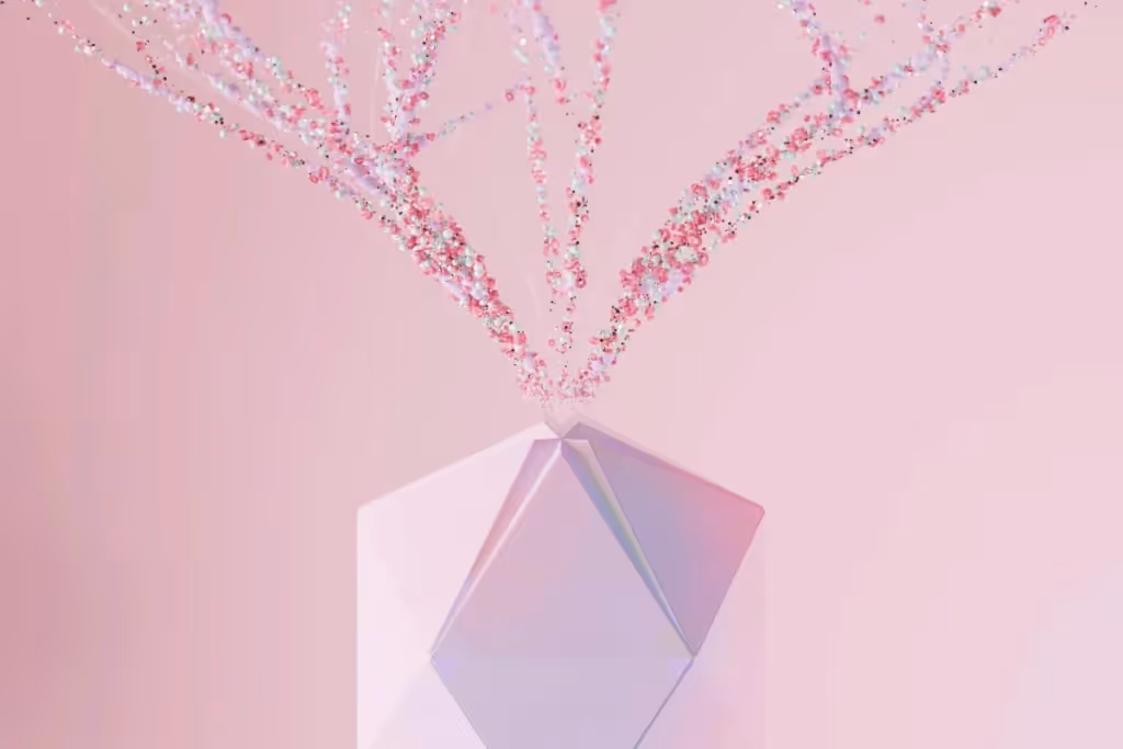 A geometric pink vase emits a sparkling explosion of confetti-like colors against a soft pink background.