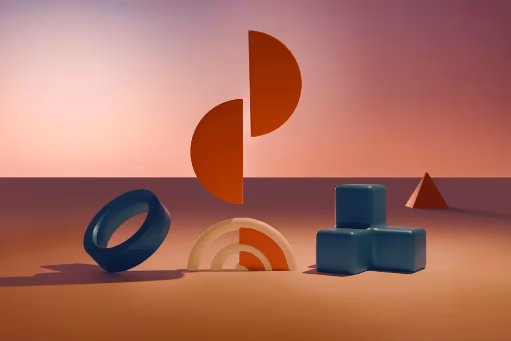 Abstract shapes in vibrant colors, including a ring, blocks, and half circles, set against a smooth gradient background.