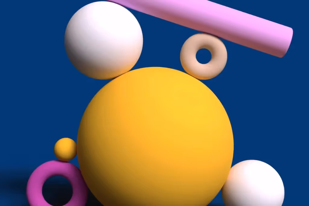A collection of colorful 3D spheres, including yellow, pink, white, and beige, on a blue background.