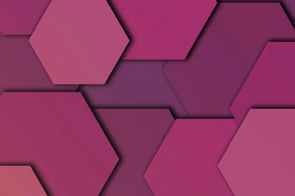 Close-up of hexagonal patterns in gradient pink hues creating a modern digital design