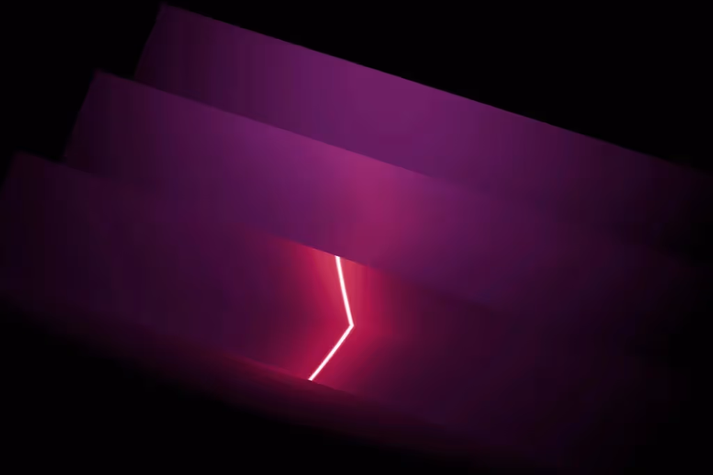 Modern abstract background showcasing purple layers with a glowing, angular white light cutting through the scene.