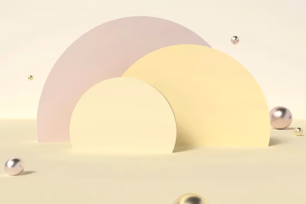 Abstract 3D shapes with pastel semicircles and floating metallic spheres.