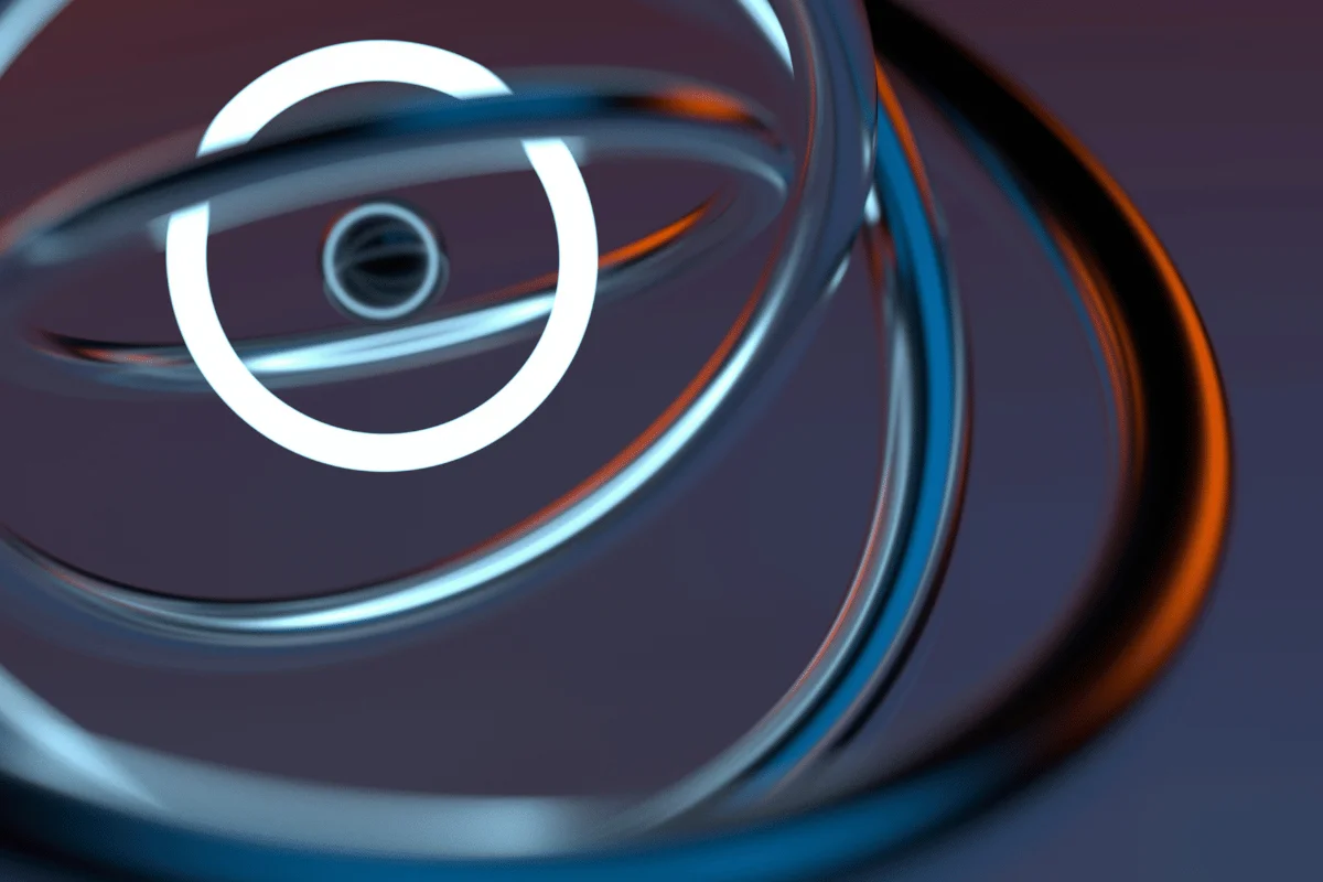 Abstract image of glowing white and blue rings spiraling in 3D space with orange highlights on a dark gradient background.