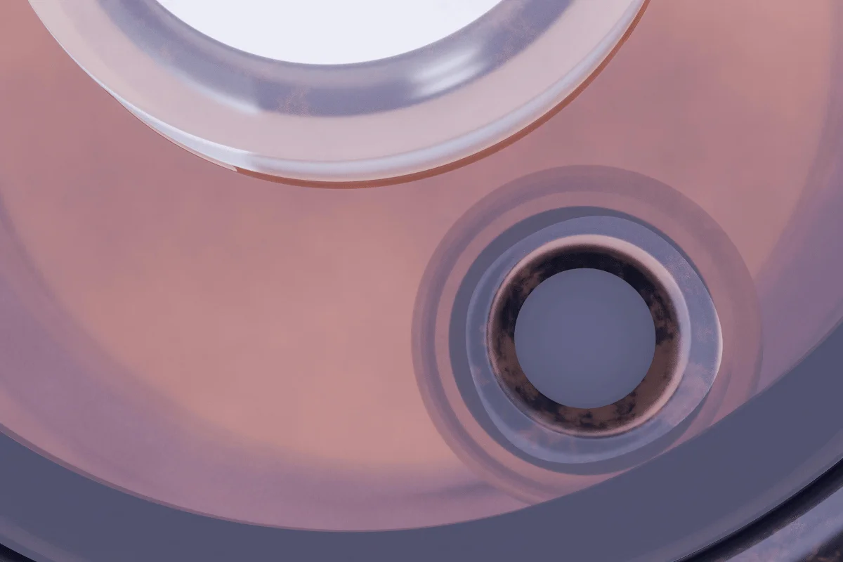 Abstract close-up of overlapping transparent circles with soft pink and brown tones.