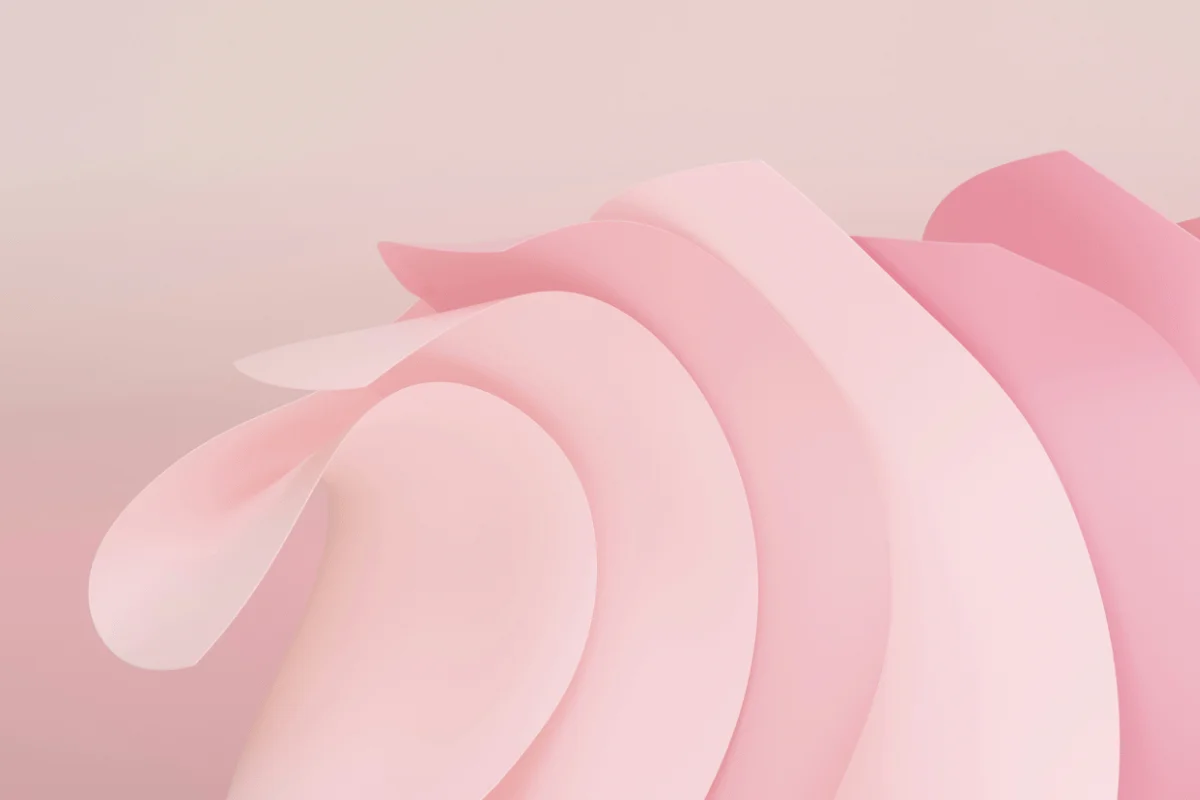 Abstract image with soft pink and peach layered curves, resembling petals. 