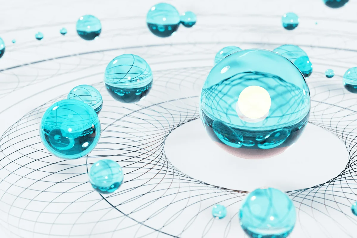 3D rendering of transparent turquoise orbs on a white background.