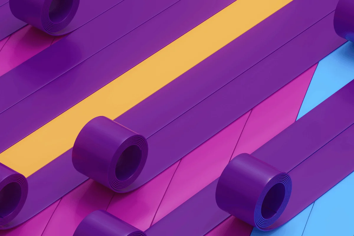 Abstract composition with purple, yellow, and blue tape rolls.