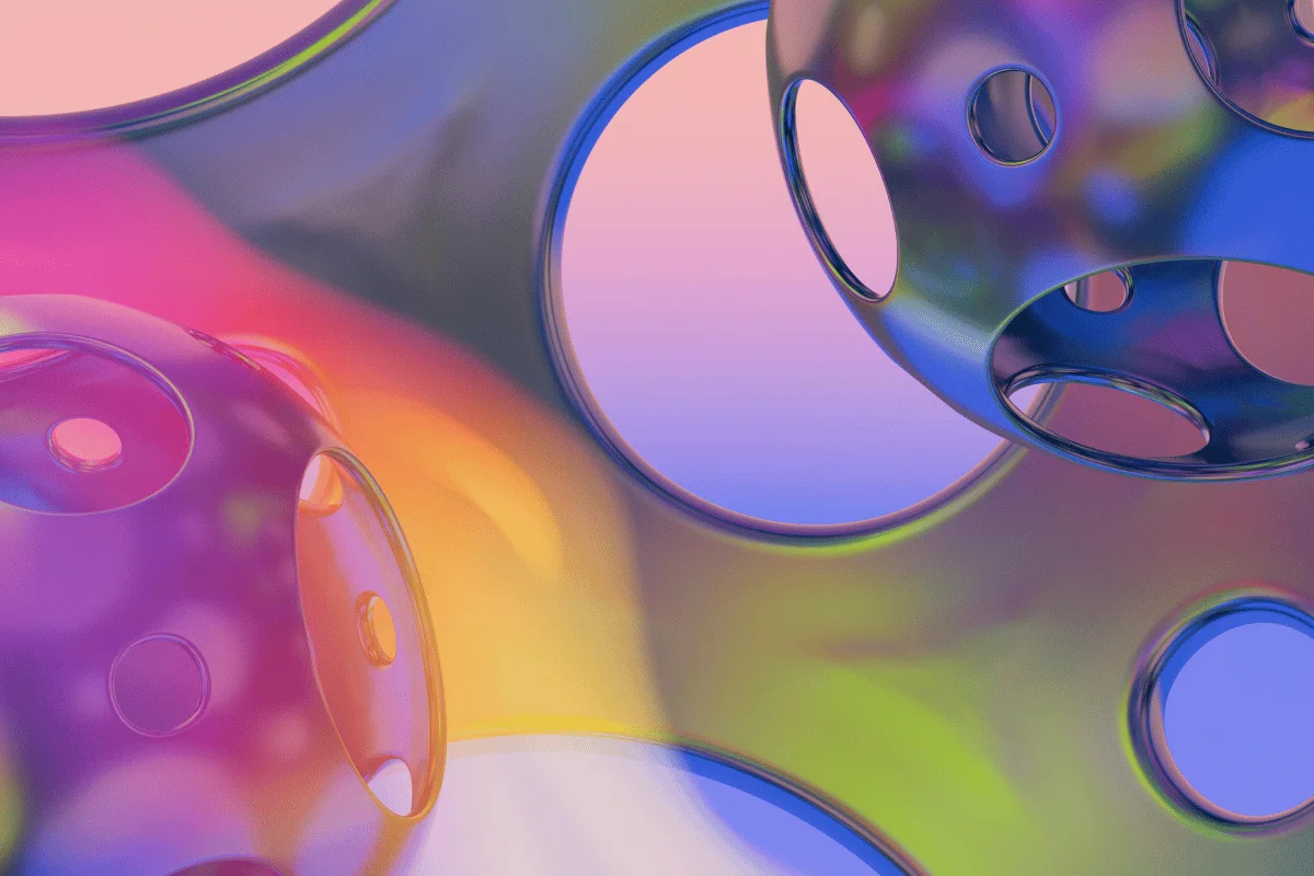 Colorful 3D abstract spheres with circular cutouts and gradient lighting.