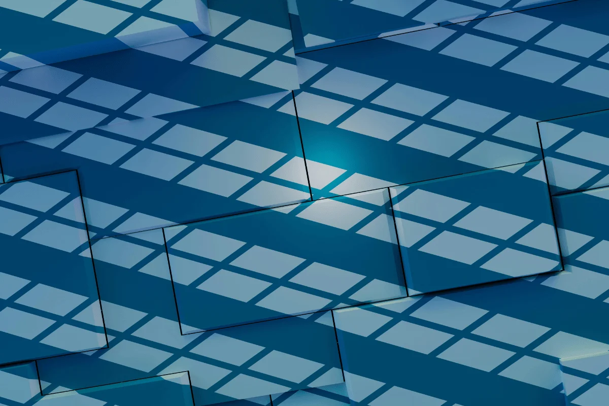 Dynamic light reflections on a modern architectural glass facade.