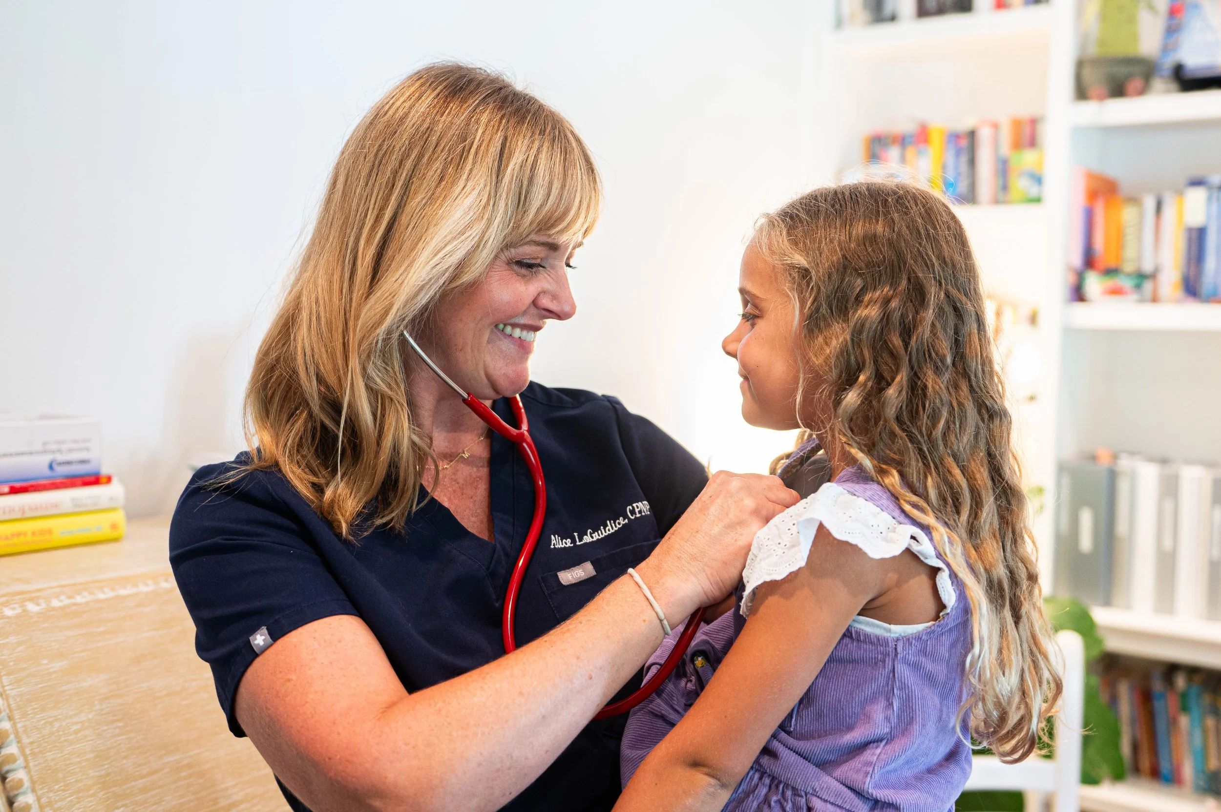 a doctor listening attentively to a young patient in a bright, modern clinic