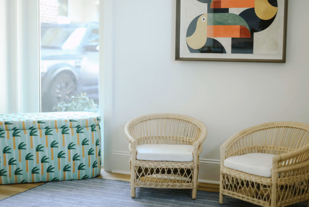 Picutre of two kids' chairs in a waiting room.