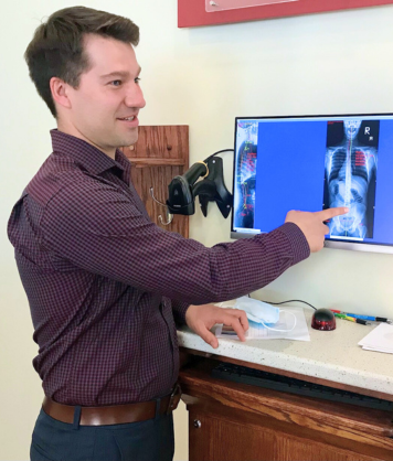 Woman soaking her feet in an ionic electric foot bath with bubbling water.