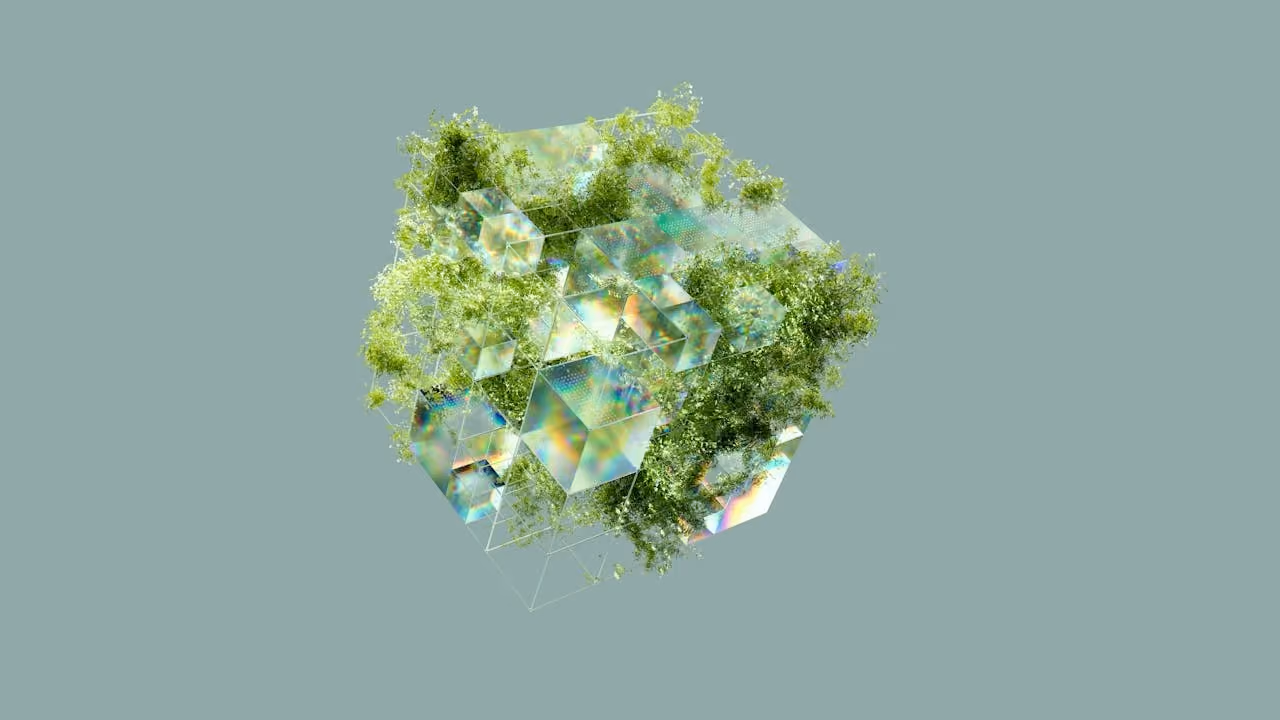 Cluster of translucent cubes intertwined with green foliage on muted green background.