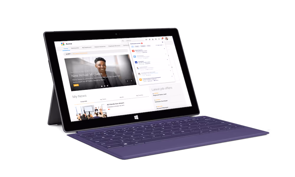 Tablet with purple keyboard showing company intranet with news, notifications, and job offers.