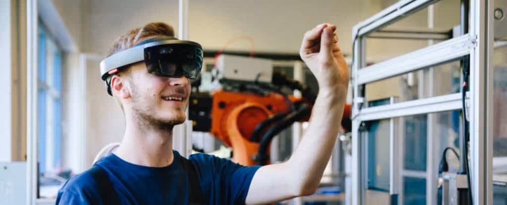 A person wearing augmented reality glasses interacts with a virtual interface in a modern lab, fostering continuous improvement in their technical workspace. Beekeeper