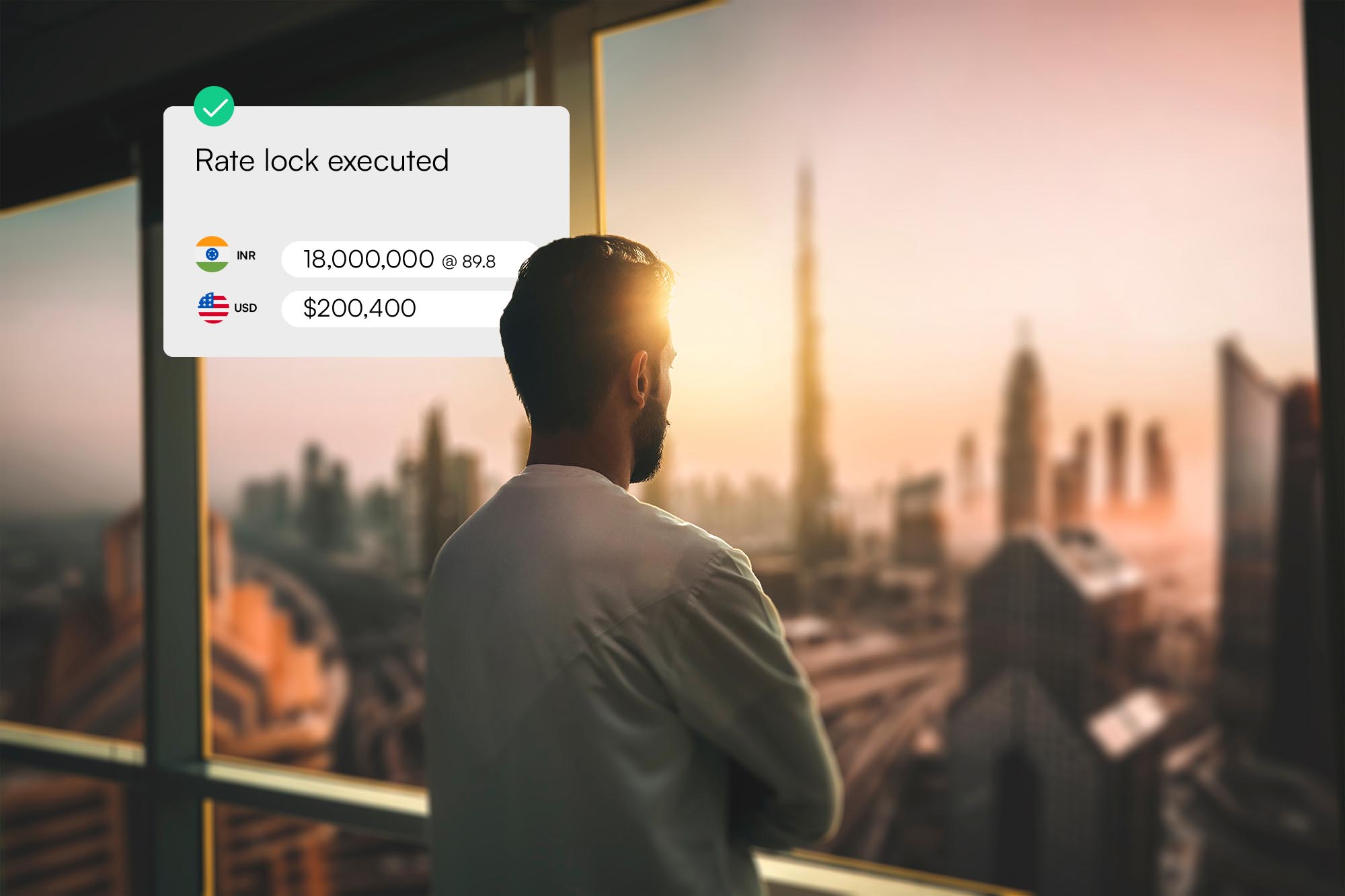 Man seen from behind looking out at a city skyline during sunset with a graphic overlay showing a confirmed rate lock: 18,000,000 INR at 89.8, equivalent to $200,400 USD.