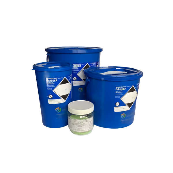 Four blue chemical containers of different sizes, one with a warning label, arranged together.