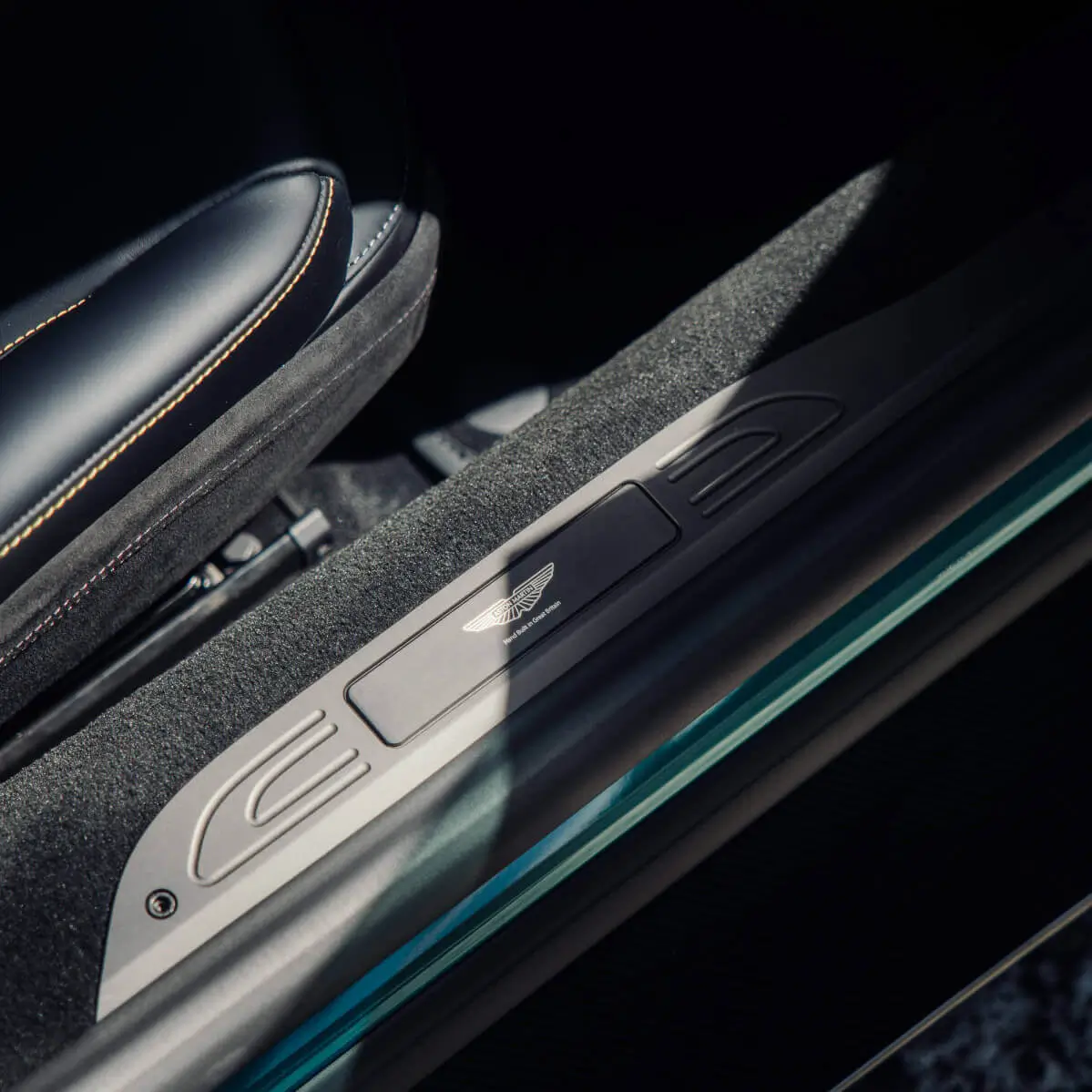 Aston Martin door sill detailed and protected during a ceramic coating service