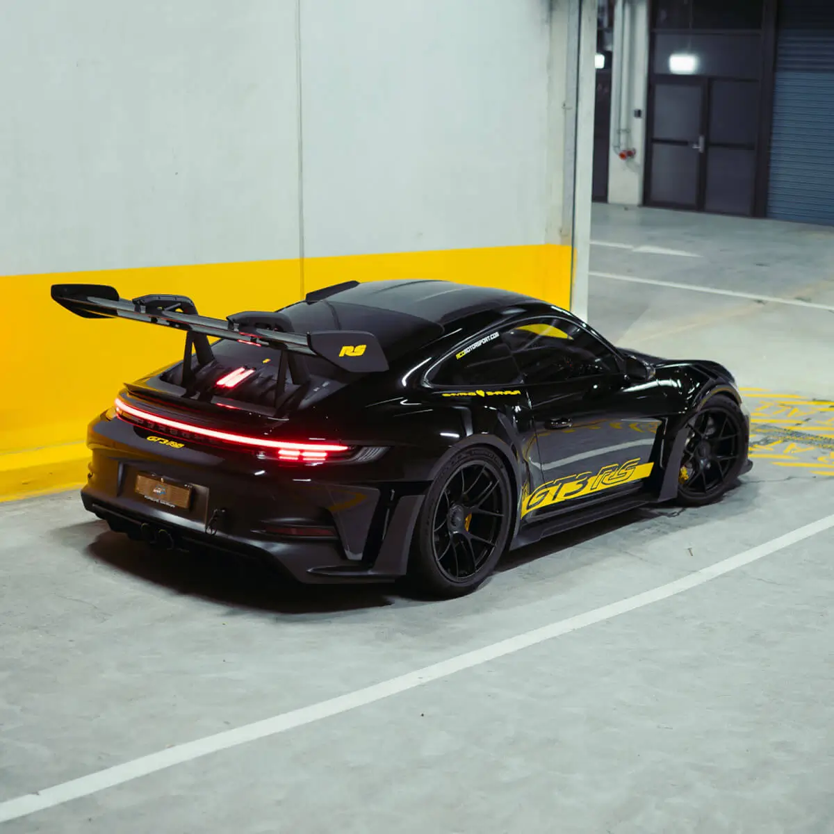 Rear view of a Porsche GT3 RS with paint protection film applied to high wear areas