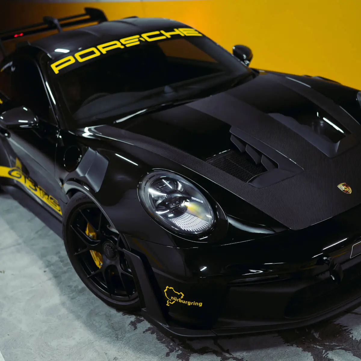 Close up of a Porsche GT3 RS bonnet and headlight protected with paint protection film