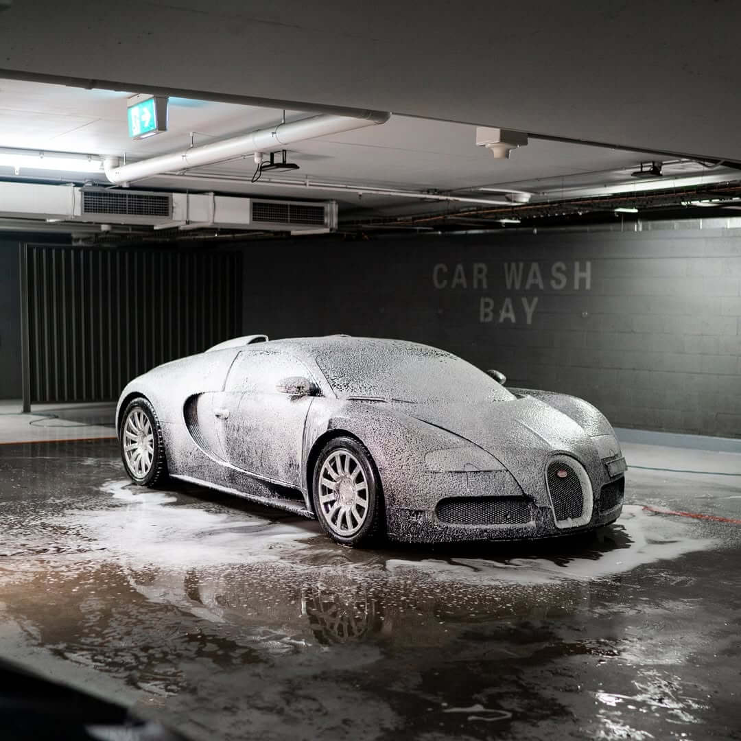 Bugatti Veyron covered in foam during a professional hand wash detailing service