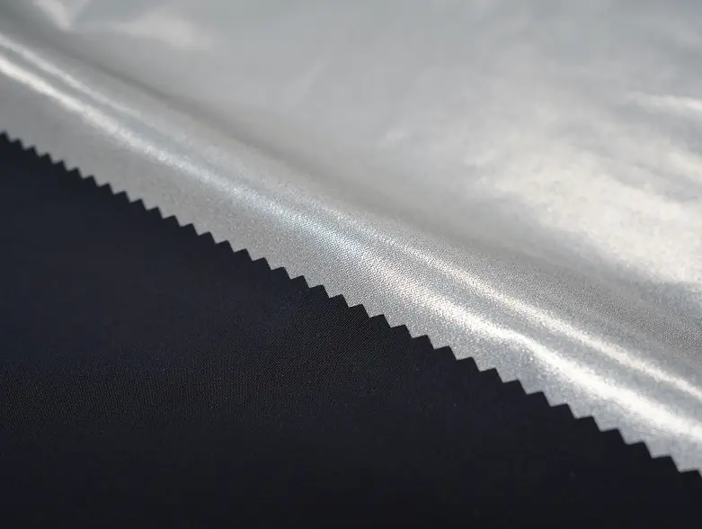 XReflex Weather Barrier fabric, silver reflective face over a navy base