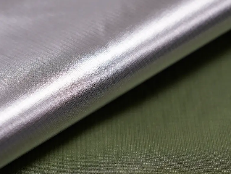 XReflex Wovens fabric, silver reflective face over an olive base