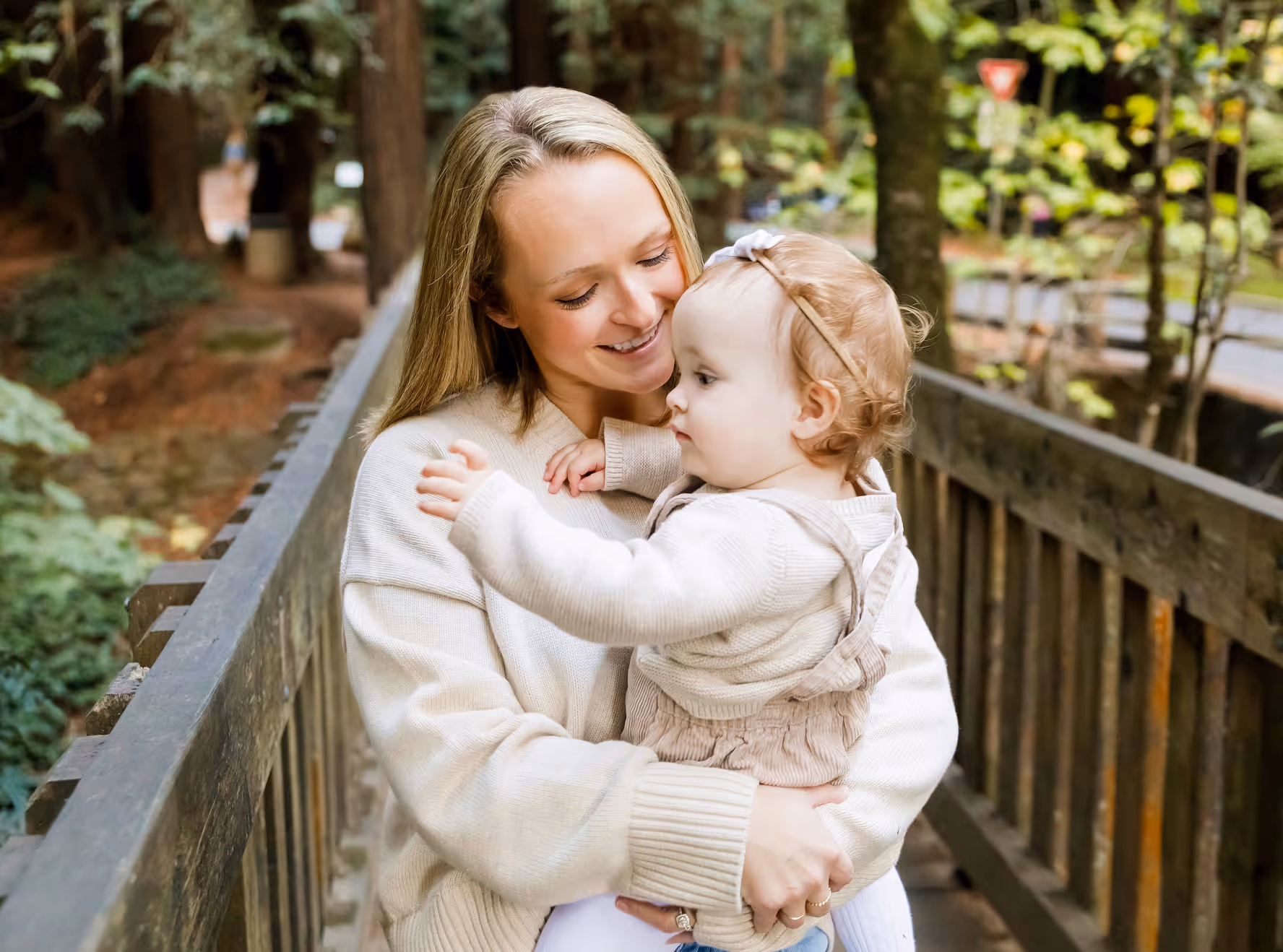 Picture of the best fractional growth marketer in the world, Mel Chiri, holding her daughter.