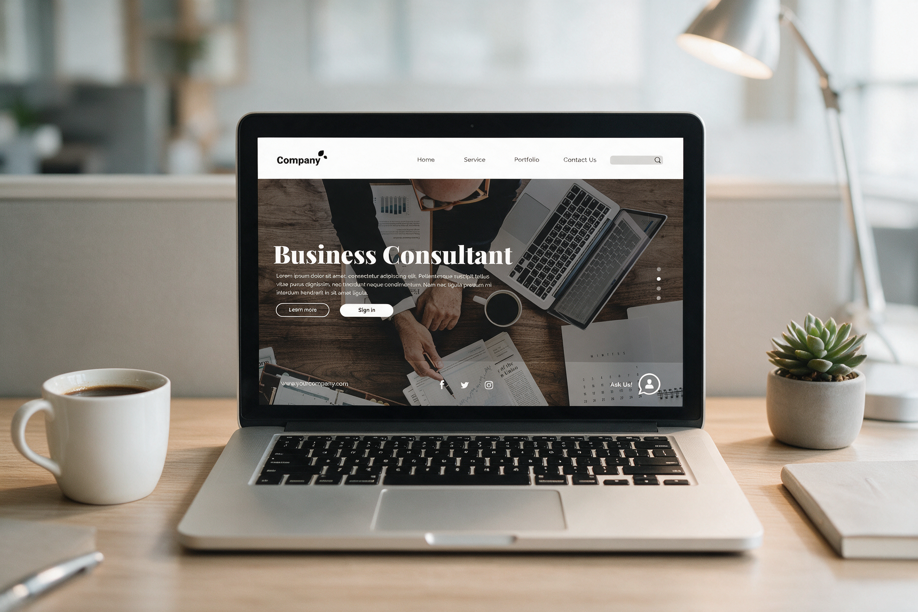 A business website open on a laptop in an office — the kind of agency site that typically runs on PHP.