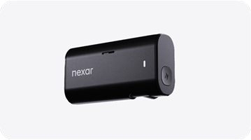 Compact black Nexar Beam Mini dash camera with rounded edges on a light background.