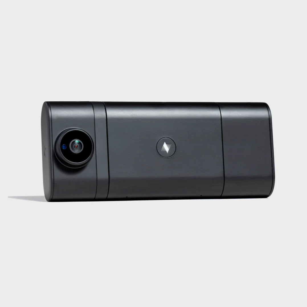 Black rectangular dash camera with a wide-angle lens on the left side and a logo in the center.