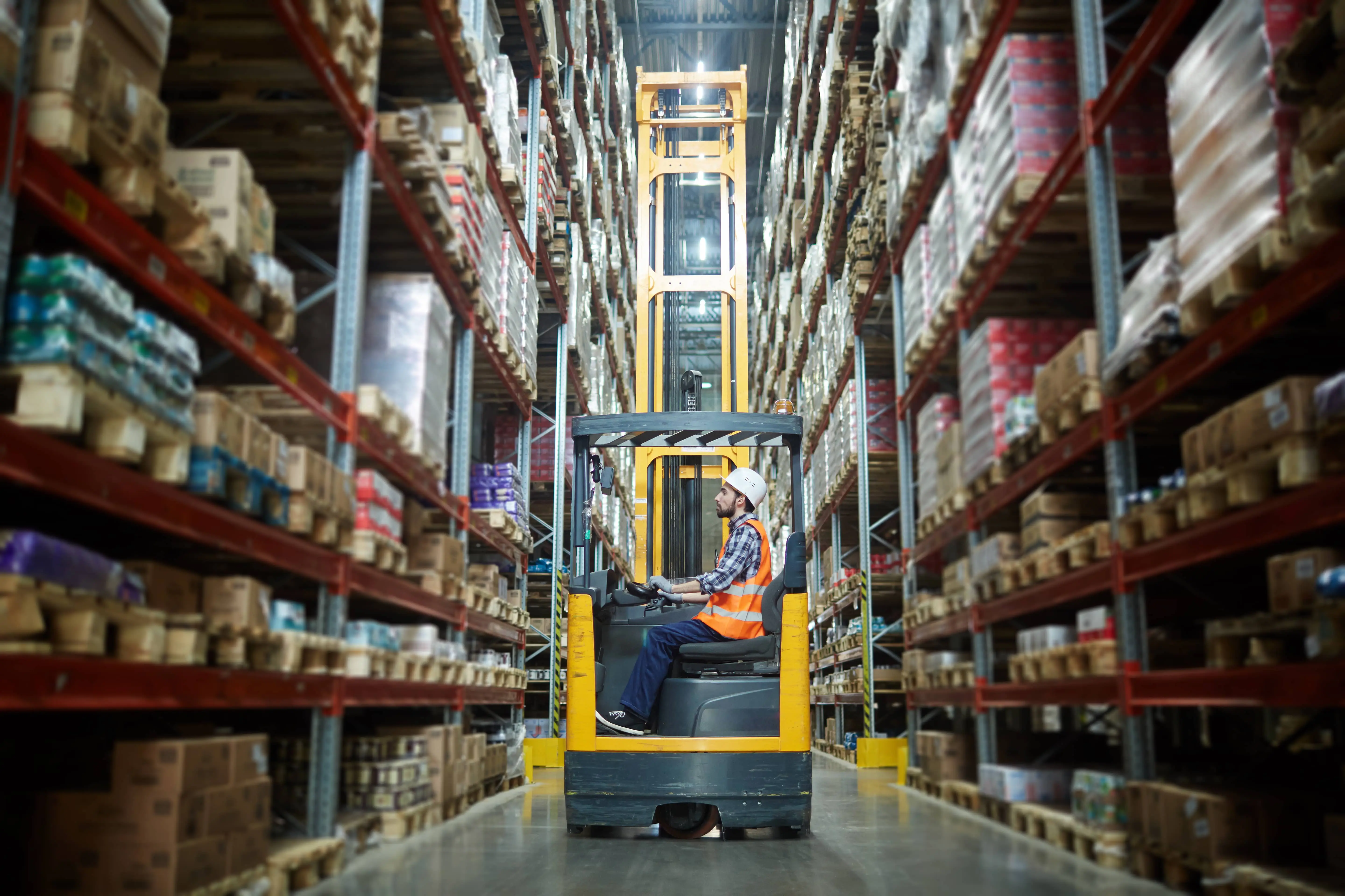 Workers loading packed goods in optimized warehouse operation