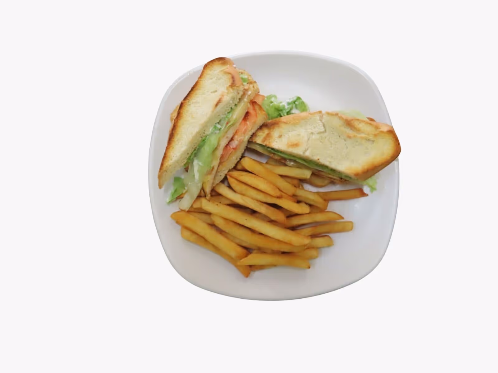 Plate with a sandwich cut in half containing lettuce and tomato, served with French fries.