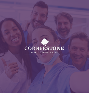 Smiling woman sitting outdoors, holding a smartphone.