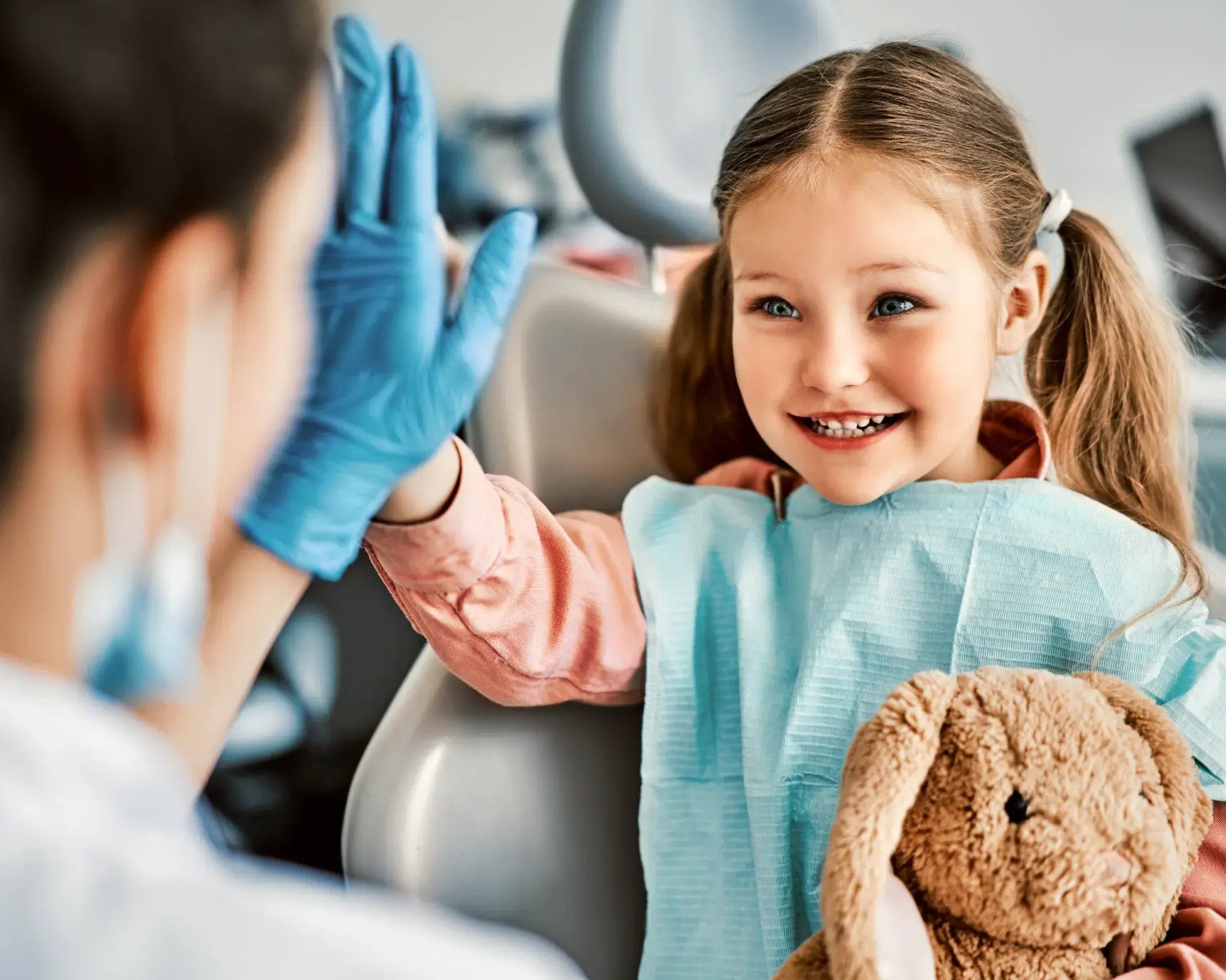 Girl giving high five to the dentist