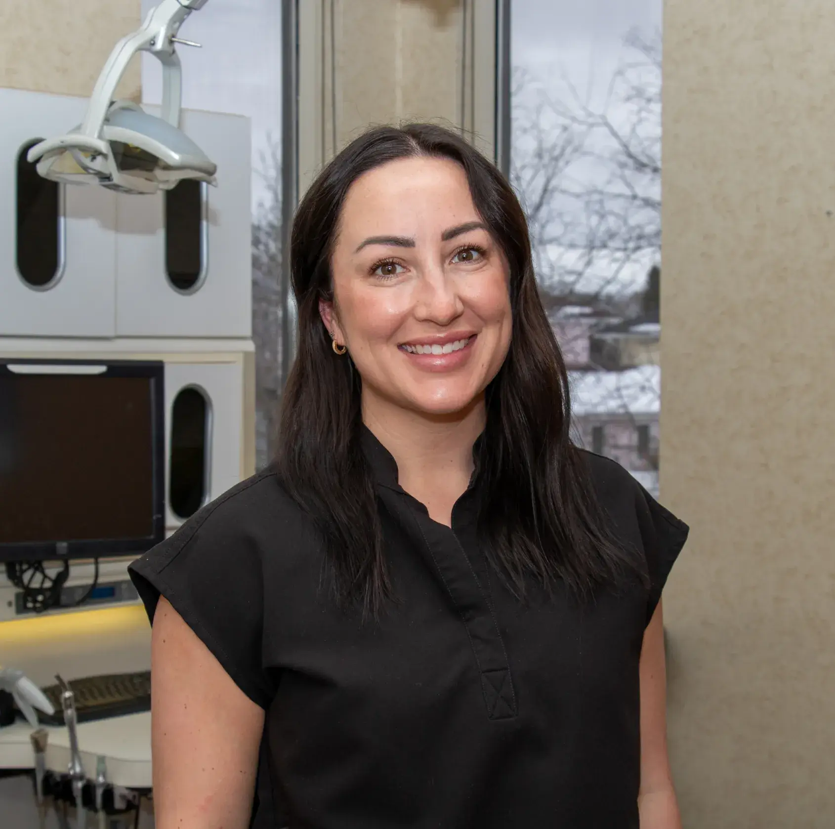 A beige brick building with a sign reading "Cornerstone Family Dentistry" above two windows.