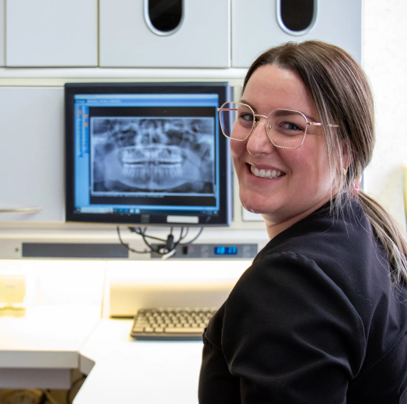 Woman looking at X-rays in the computer