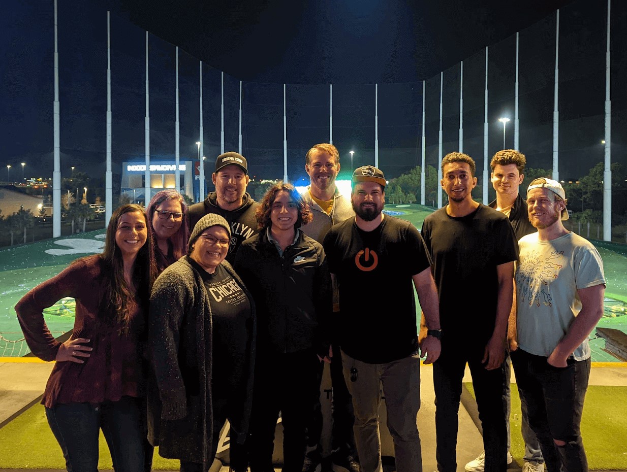 Yac 2022 retreat attendees posing at TopGolf Tampa