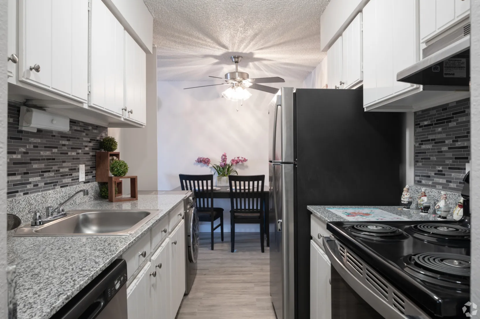 kitchen with stainless steel appliances and view of dining area with chairs