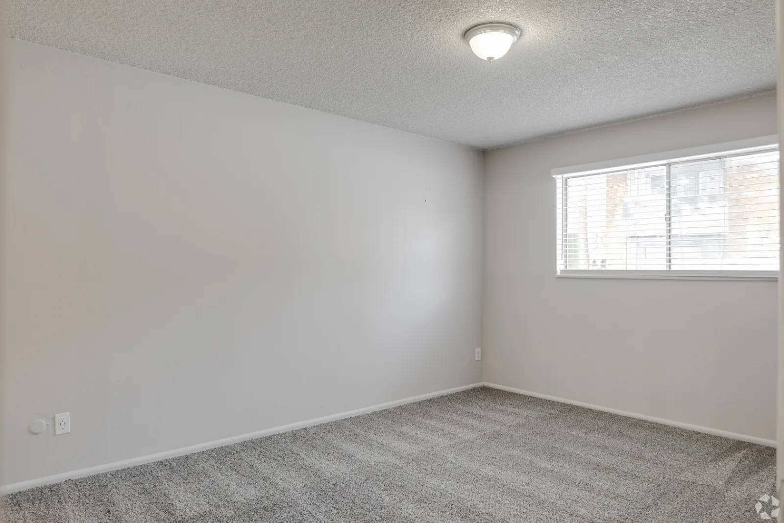 unfurnished bedroom with window