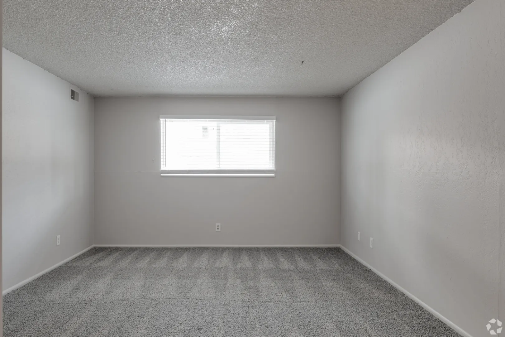 unfurnished bedroom with window