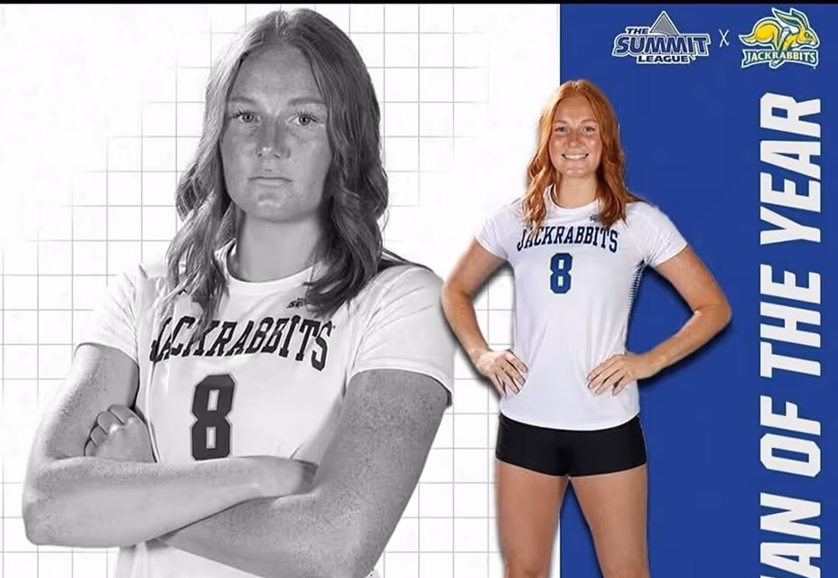 Female athletes posing together in team uniforms
