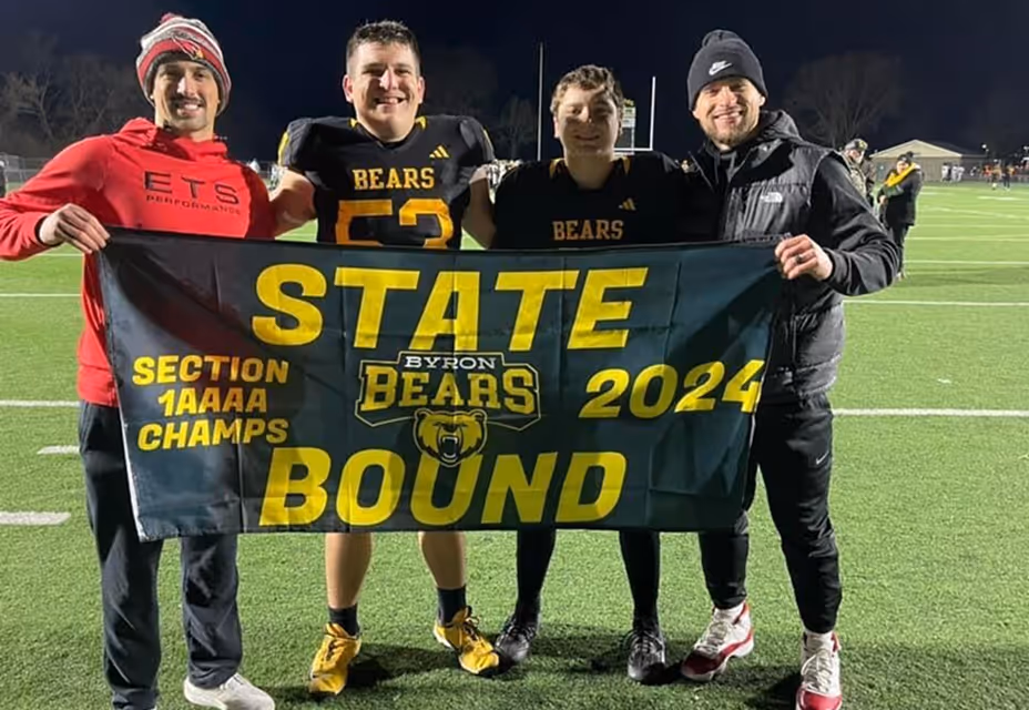 High school team celebrating state championship qualification