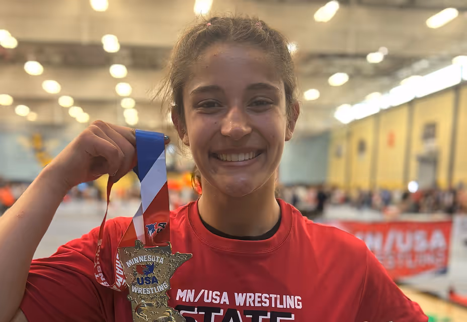 Youth athlete smiling after competition event