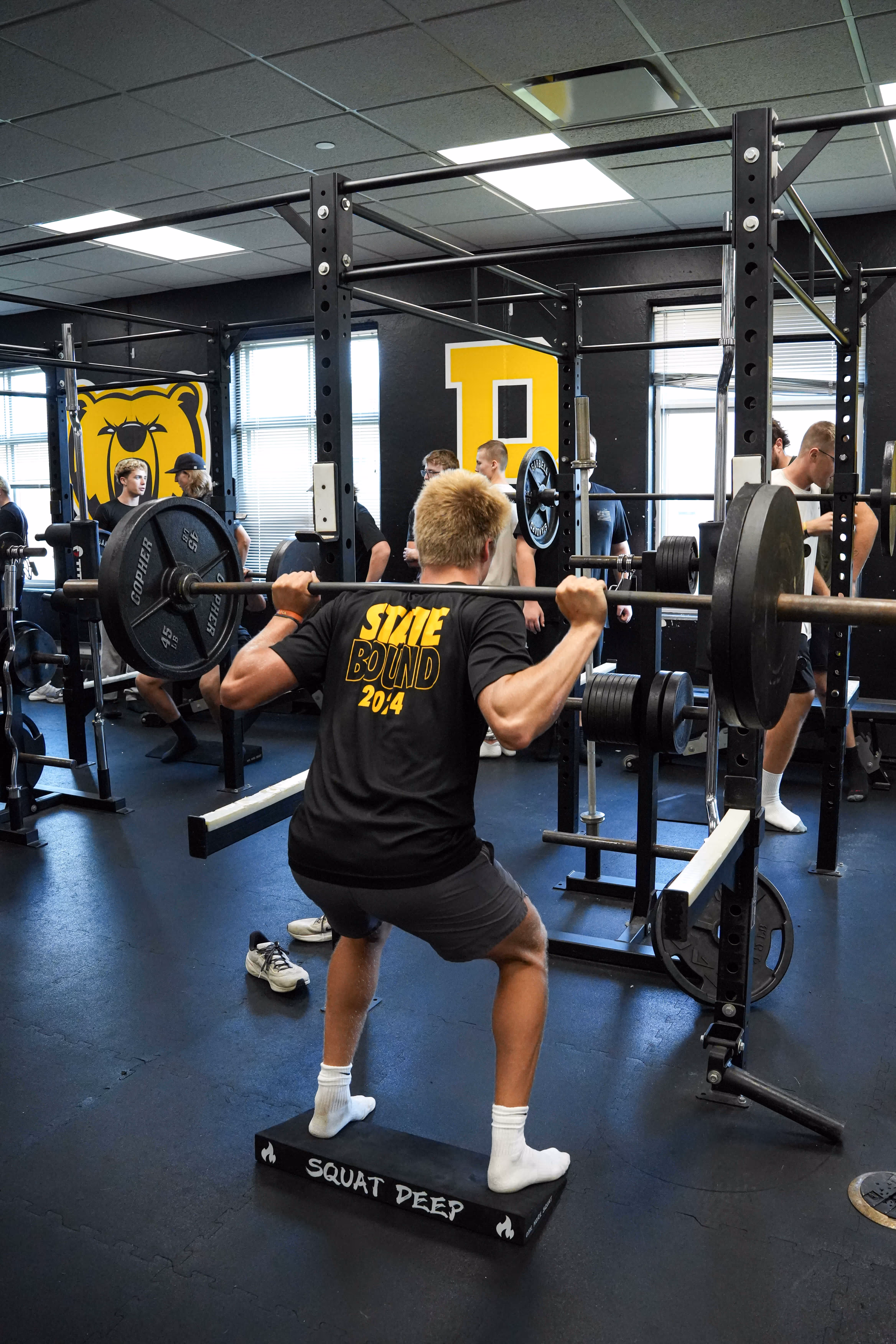 High school athletes training with strength equipment at ETS Performance