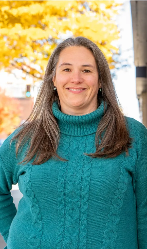 woman in sweater smiling