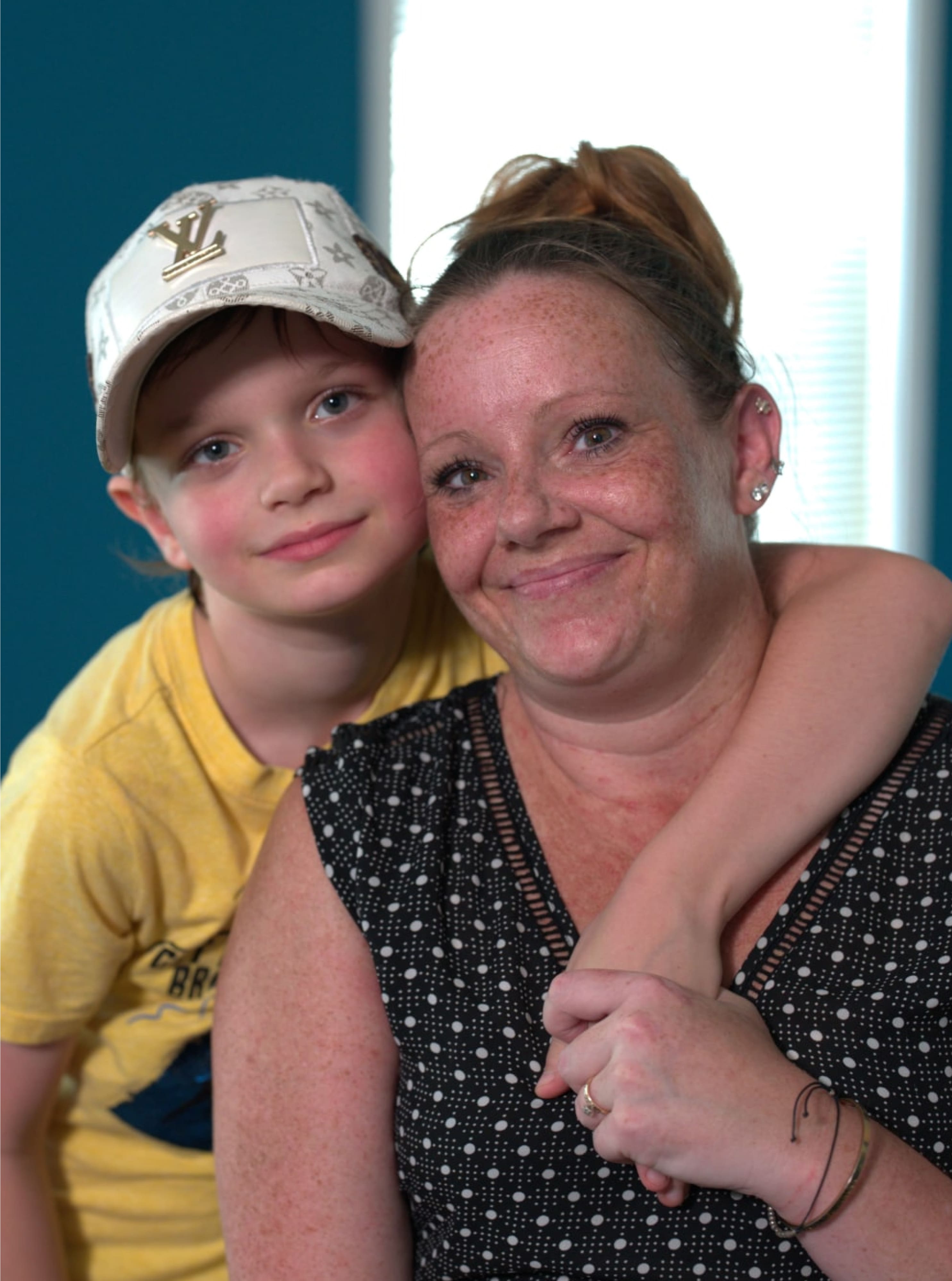 mother and her son smiling at camera